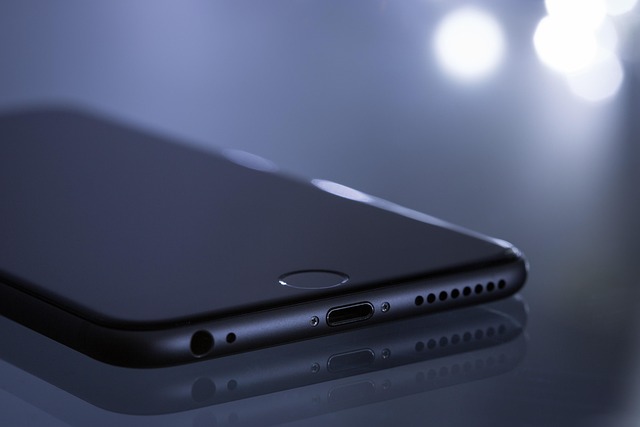 person using smartphone to control smart home devices energy and climate